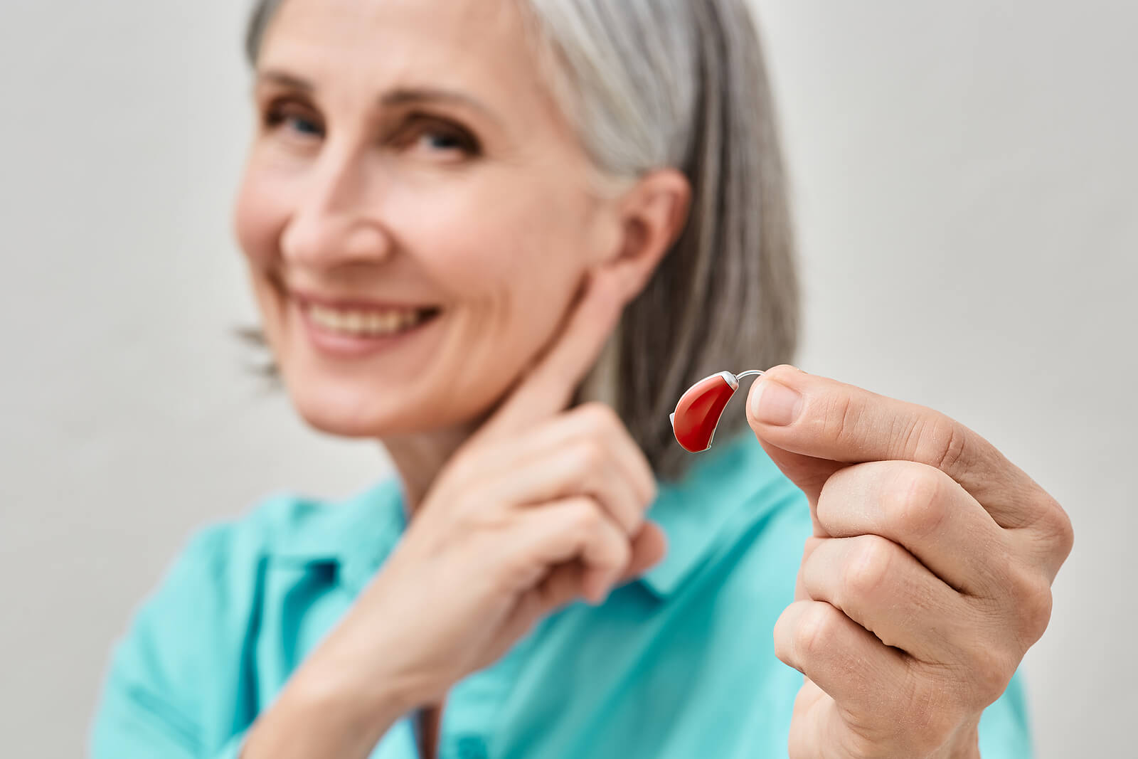 hearing aid being held by patient